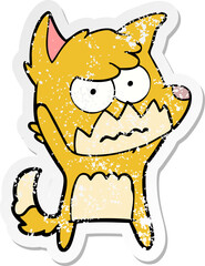 distressed sticker of a cartoon annoyed fox