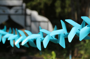 Blue toy windmill in the park