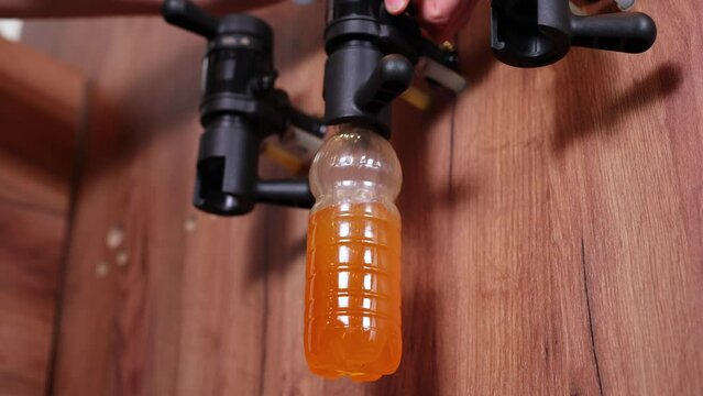 Beer shop. Beer is poured into a plastic bottle at a beer shop