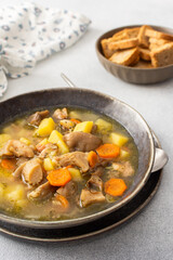 Oyster mushroom soup in plates, soup made from Pleurotus mushrooms and potatoes, carrots and spices