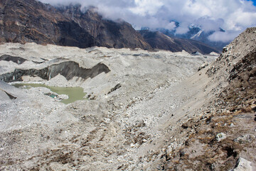 Ngozumpa Glacier, Nepal's largest glacier with massive debris, stone, ice and clay deposits, flows...