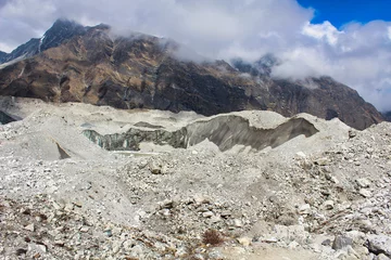 Papier Peint photo Cho Oyu Ngozumpa Glacier, Nepal's largest glacier with massive debris, stone, ice and clay deposits, flows from Cho Oyu and is the headwaters of the Dudh Kosi that travels over 1500 kms to the Bay of Bengal