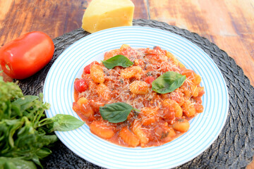 Gnocchi with red Bolognese sauce, typical Italian pasta potato food taste