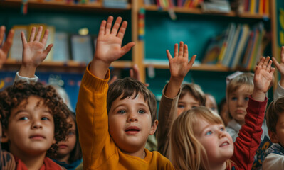 Fototapeta premium Young Children In Preschool With Hands Raised