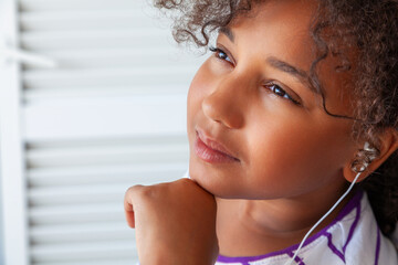 Mixed Race African American Girl Listening to White Headphones - 751624641
