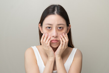 Bored, insomnia asian young woman, girl looking at mirror hand touching under eyes with problem of black circles or panda puffy, swollen and wrinkle on face. Sleepless, sleepy healthcare person.