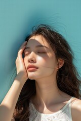 Young Asian beauty woman, on isolated light blue background. sunlight.