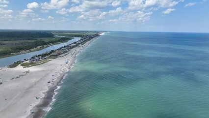 Vacation beach houses by the sea on the coast of South Carolina at Pawleys Island in early morning sunlight on a warm summer day 