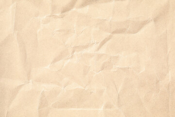 Brown crumpled paper texture with grains macro closeup