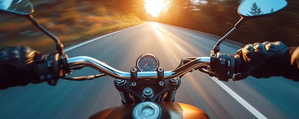 Schilderijen op glas Motorbike rider in sunset light riding with high speed © Daniela