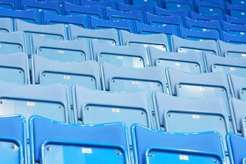 Foto op Plexiglas Rows of blue empty seats with numbers in big modern sport stadium © Pavel Losevsky