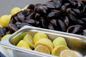 mussels and lemons on a plate, street food  in Istanbul Bosphorus port