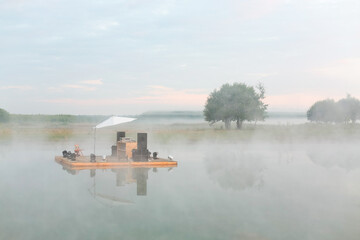 Improvised scene with audio equipment on raft floating on river Ugra