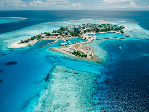 Gulhi island near Maafushi on Kaafu Atoll. Local island with blue ocean on Maldives. Aerial View