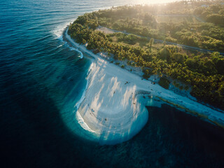 Maldives island with beach and sunrise sunshine. Aerial view of ocean coastline on Fuvahmulah island