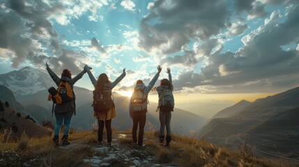 back view group of people spending time together in the mountains and excited making a winner gesture with arms raised over with cloudy sky.