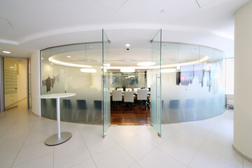  Glass walls and open door to empty conference room in office of Moscow Exchange
