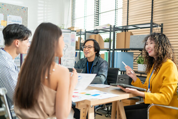 Group of young asian creative business brain storm meeting presentation,discussing roadmap to product launch, planning,strategy,new business development,working with new startup project in office.