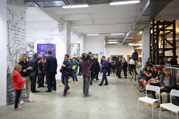  Videographer and visitors in Michelangelo exhibition in Artplay Design Center