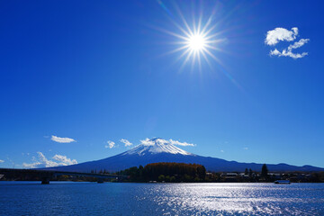 Day view of the snow-capped Mount Fuji in the fall in Lake Kawaguchi (Fujikawaguchiko), Japan - 751656892