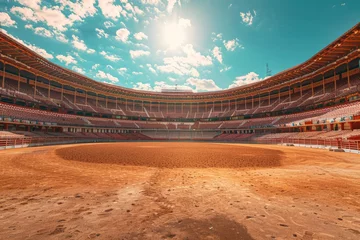 Foto auf Acrylglas An empty round bullfight arena in Spain with a clock tower in the background. The traditional Spanish bullring stands silently, devoid of any audience or performers. © pham