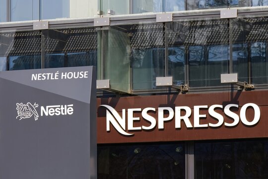 Close-up of Nestle and Nespresso logo sign at their office, Nespresso is a brand of coffee of Nestle.