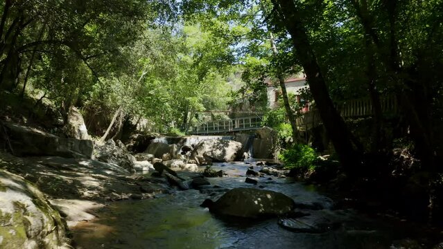 Aerial shot of an operational paper mill in the Black Mountain, north of Carcassonne, in the small village of Brousses et Villaret. Seen from a shaded path alongside a small stream.