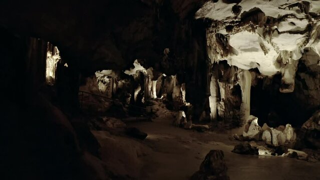 Forward tracking shot of the giant chasm of Cabrespine in southern France. Cinematic shot of a big cave.