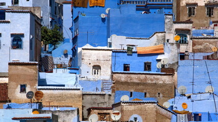 Blue and white buildings on a slope in the medina, in Chefchaouen, Morocco