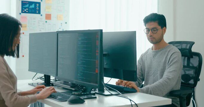 Group Adult Asia male, female freelance typing write prompt AI bot IT app smart program nomad, video game, terminal with coding language, user interface, designer, big data center on desktop computer.