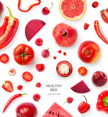 Creative layout made of red tomato, bell pepper, red apple, strawberry, cherry, mangosteen, beetroot, watermelon, grapefruit on the white background. Flat lay. Macro concept of red vegetables, fruits.