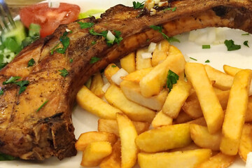 fries with fried pork on the bone