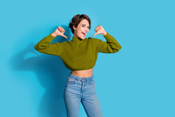 Photo of glad positive girl wear stylish khaki clothes two thumbs indicate herself isolated on cyan...