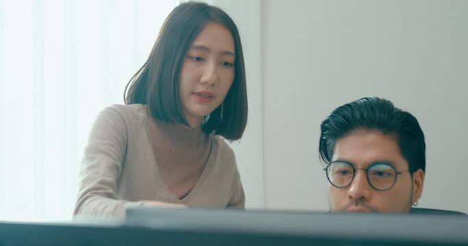 Group Adult Asia male, female freelance meeting write prompt AI bot IT app smart program nomad, video game, talk strategy, discuss plan, user interface, designer, big data center on desktop computer.