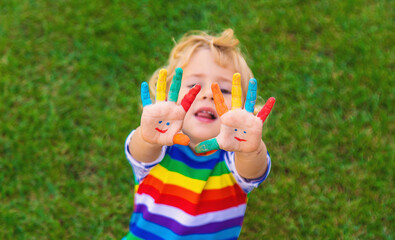 Child in hand draw smile. Selective focus.