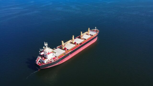 Bulk carrier or bulker is a merchant ship for unpackaged bulk cargo, such as grains, ore, coal. Aerial wide shot