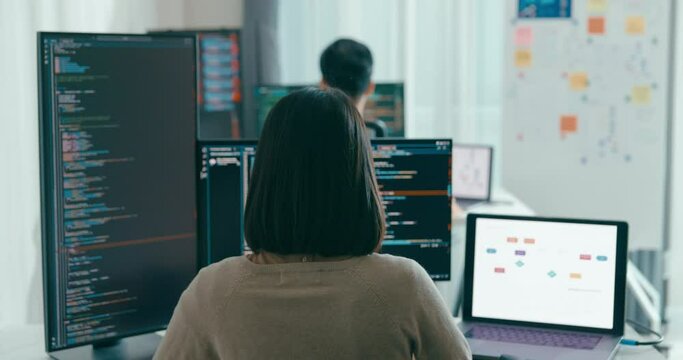 Group Adult Asia male, female freelance typing write prompt AI bot IT app smart program nomad, video game, terminal with coding language, user interface, designer, big data center on desktop computer.