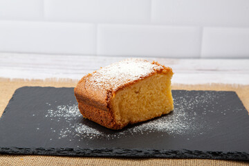 A steaming cup of coffee paired with a delectable slice of cake, a delightful blend of warmth and sweetness.