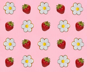 Gingerbread cookies in the shape of chamomile and strawberry on the pink background. Top view. Copy space.