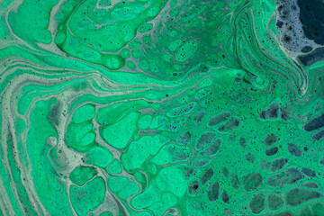 Fototapeta na wymiar Beautiful fluid art natural luxury painting. Marbleized effect. Ancient oriental drawing technique. Teal, green, blue and turquoise colors. Abstract decorative marble texture. 