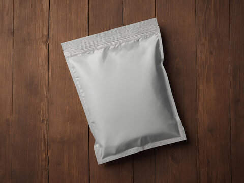 Image for white packaging bag mockup, on a wooden table, top view with header seal