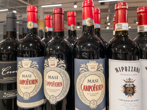 Variety of Italian Red Wines Displayed in Store