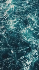 Blue sea water texture background. Top view of sea surface with waves