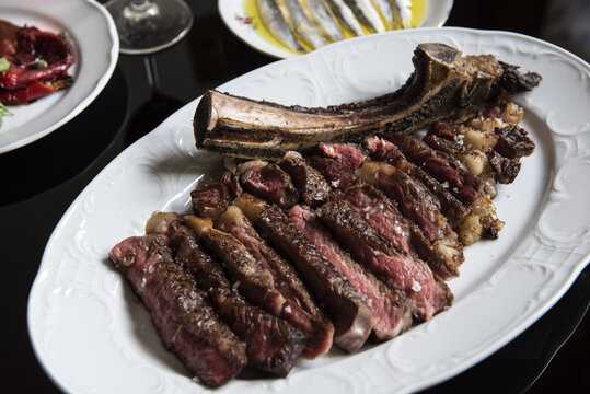Cote de boeuf beef plated in restaurant
