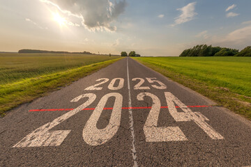 numbers 2024, 2025 on asphalt road highway with sunrise or sunset sky background. concept of...