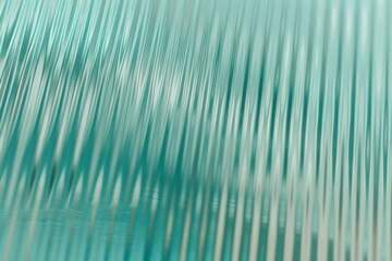 Abstract wave glass vertical line pattern background. Texture of wavy glass illuminated with light.