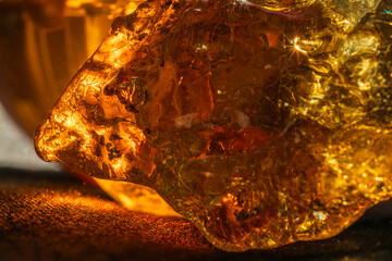 Amber crystal close up in orange light