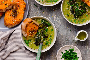 Roasted broccoli soup with melted cheddar croutons.style hugge.selective focus