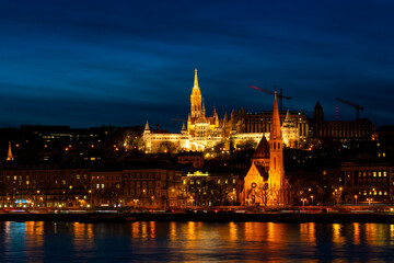Fototapeta na wymiar Matthias Church illuminated at night in Budapest, Hungary
