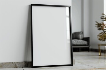 Empty thin black frame on light wooden floor with white wall behind it. Empty poster fram
